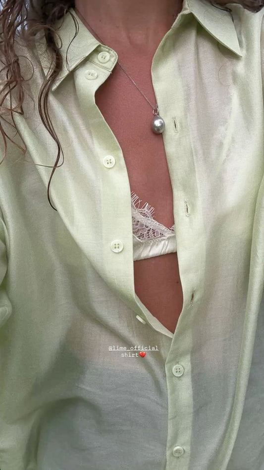 Green Chiffon Button Up Shirt with White Lace Bra Showing